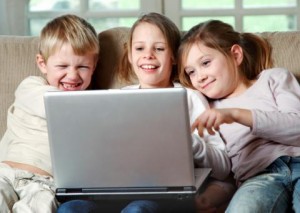 3 kids on a laptop