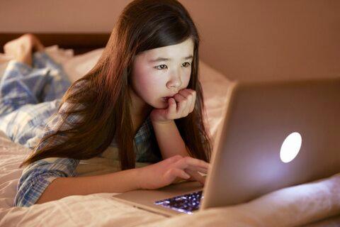 young girl on laptop