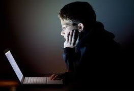 Teen on the computer late at night when he should be sleeping