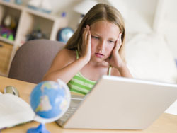girl on computer being exposed to online risks