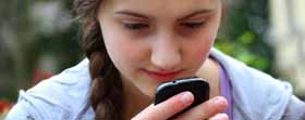 teen girl using apps on cellphone