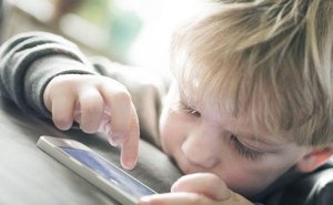 toddler using a smarphone