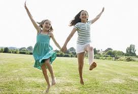 two girls enjoying the world around them instead of looking at a computer device