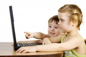 young children on computer devices